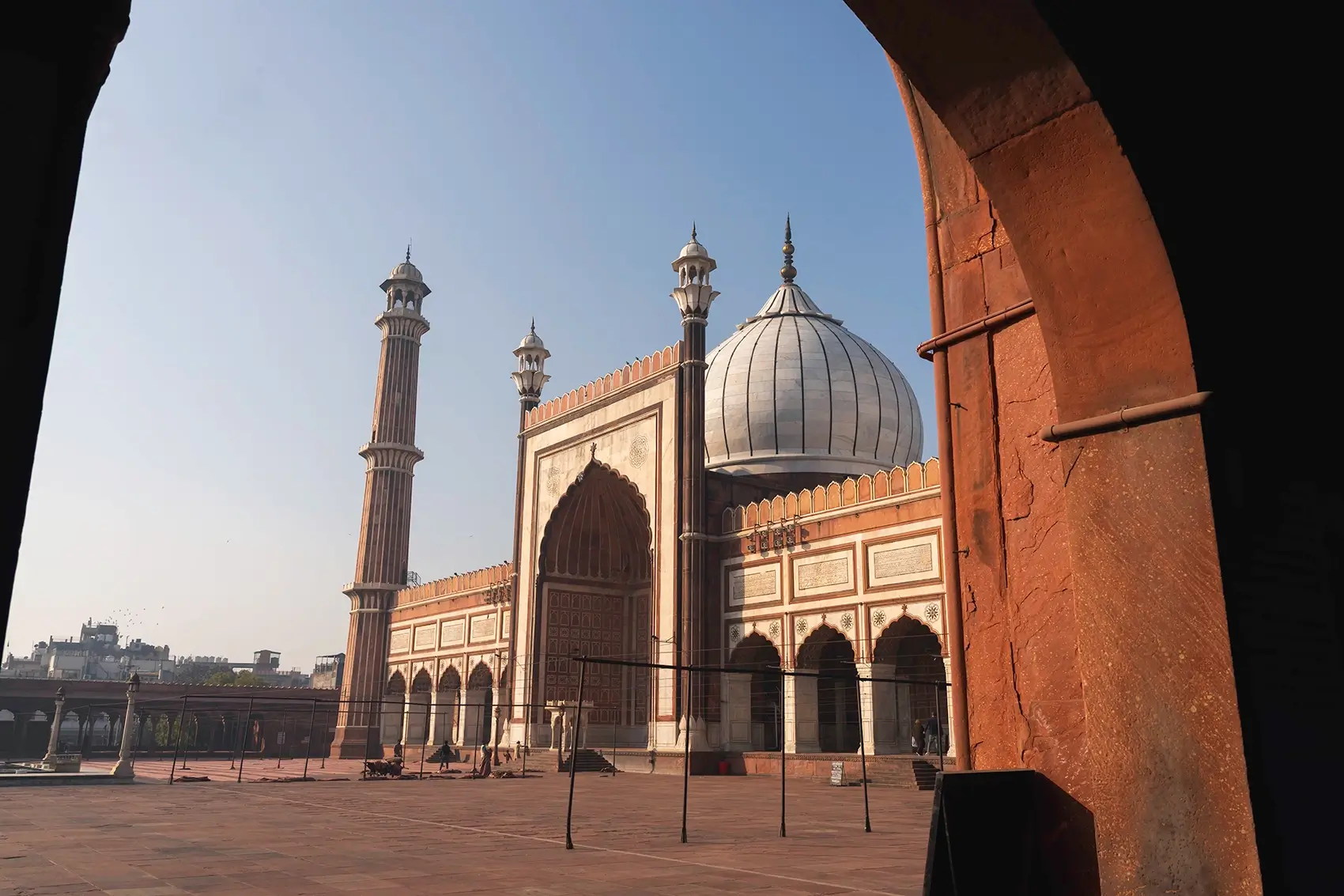 Historic mosque in India with marble dome and minarets